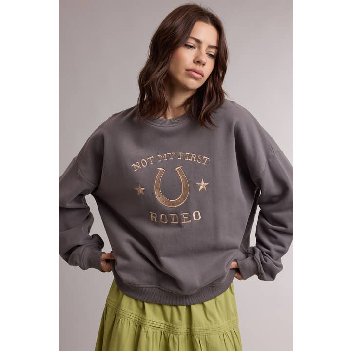 NOT MY FIRST RODEO CREW SWEATSHIRT
