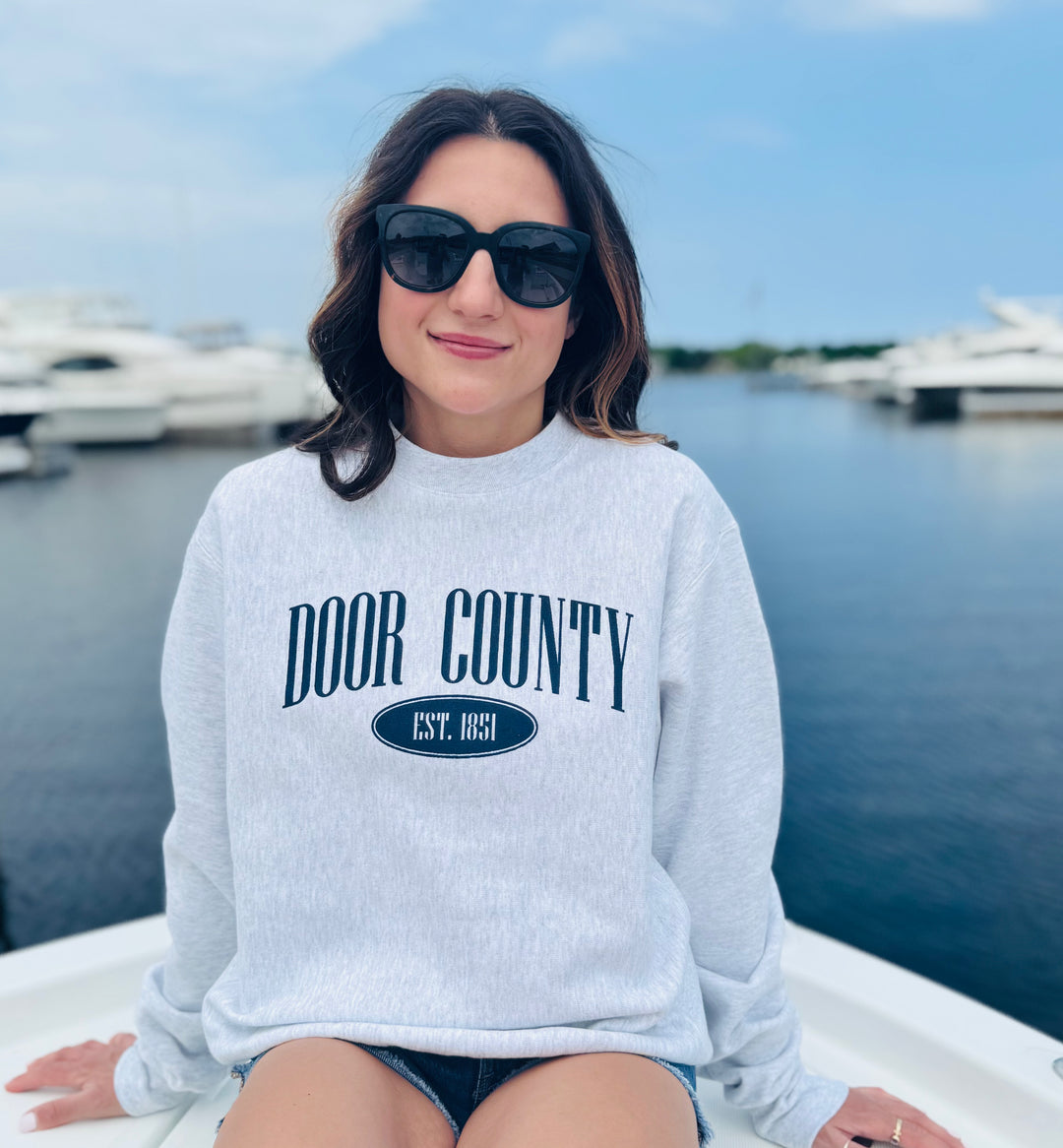 CHAMPION DOOR COUNTY REVERSE WEAVE CREW SWEATSHIRT