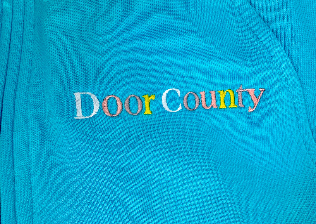 DOOR COUNTY TROPICAL BLUE EMBROIDERED  HALF ZIP SWEATSHIRT