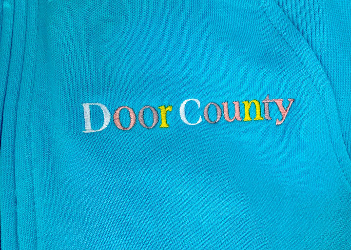 DOOR COUNTY TROPICAL BLUE EMBROIDERED  HALF ZIP SWEATSHIRT